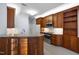 Beautiful kitchen featuring granite countertops, tiled backsplash and modern stainless steel appliances at 11011 Southwalk Ln, Raleigh, NC 27614