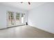 Bright living room area featuring French doors leading to the backyard at 11011 Southwalk Ln, Raleigh, NC 27614