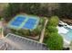 Aerial view of the community tennis courts and parking area, set near the pool at 11011 Southwalk Ln, Raleigh, NC 27614