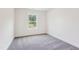 Empty bedroom with carpet, a single window, and neutral color paint at 111 Artic Circle, Garner, NC 27529