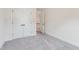 Bedroom with neutral carpet and double door closet to the left at 111 Artic Circle, Garner, NC 27529