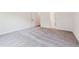 Bright bedroom featuring neutral carpet, white walls, and trim, enhancing the room's spacious feel at 111 Artic Circle, Garner, NC 27529