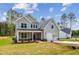 Charming two-story home featuring a two-car garage and landscaped front yard at 111 Artic Circle, Garner, NC 27529