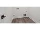 A functional laundry area featuring durable floors, modern hookups, and clean, minimalist design at 111 Artic Circle, Garner, NC 27529
