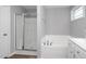 Bathroom boasting a glass enclosed shower, tub, and a clean white vanity at 121 Viajar Way, Smithfield, NC 27577