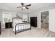 This bedroom features carpet flooring, access to another room, and neutral wall color at 121 Viajar Way, Smithfield, NC 27577