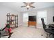 Bedroom includes chair, exercise bike, desk, and shelves at 121 Viajar Way, Smithfield, NC 27577
