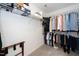 Walk-in closet with metal shelving and lots of clothing on display at 121 Viajar Way, Smithfield, NC 27577