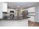 Modern kitchen with stainless steel appliances, granite countertops, and ample storage at 121 Viajar Way, Smithfield, NC 27577