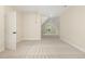 Spacious carpeted attic with a door to storage space and a window at the end of the room at 1221 Azalea Garden Cir, Raleigh, NC 27603