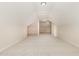 Finished attic featuring carpeted floors and ceiling lights throughout at 1221 Azalea Garden Cir, Raleigh, NC 27603