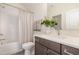 Bathroom showcasing a tub and shower with a subway tile wall, vanity with a white countertop and chrome fixtures at 1221 Azalea Garden Cir, Raleigh, NC 27603