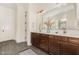 Contemporary bathroom featuring a dual sink vanity and large mirror at 1221 Azalea Garden Cir, Raleigh, NC 27603