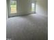 Bright bedroom featuring plush carpeting, recessed lighting, and large windows for lots of light at 1221 Azalea Garden Cir, Raleigh, NC 27603