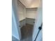 Walk-in closet features ample shelving and a cozy carpeted floor, with natural light streaming in at 1221 Azalea Garden Cir, Raleigh, NC 27603
