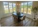 Cozy dining area with large windows offering plenty of natural light and backyard views at 1221 Azalea Garden Cir, Raleigh, NC 27603