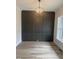 Dining Room with a dark accent wall and elegant chandelier at 1221 Azalea Garden Cir, Raleigh, NC 27603