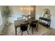 Contemporary dining room featuring stylish lighting, neutral walls, and wood flooring at 1221 Azalea Garden Cir, Raleigh, NC 27603