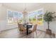 Inviting dining room with large windows offering scenic views at 1221 Azalea Garden Cir, Raleigh, NC 27603