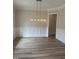 Dining room with decorative molding and a modern chandelier at 1221 Azalea Garden Cir, Raleigh, NC 27603