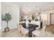 Elegant dining area with views of the kitchen and living room at 1221 Azalea Garden Cir, Raleigh, NC 27603