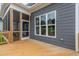 Exterior shot of the screened-in porch and surrounding yard at 1221 Azalea Garden Cir, Raleigh, NC 27603
