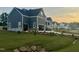 View of newly built home with 3-car garage, manicured lawn, and a charming design that blends style and comfort at 1221 Azalea Garden Cir, Raleigh, NC 27603