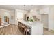 Spacious kitchen with white cabinets, large island, and stylish pendant lighting at 1221 Azalea Garden Cir, Raleigh, NC 27603