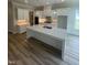 Bright, open kitchen with a large center island, stainless appliances, and pristine countertops at 1221 Azalea Garden Cir, Raleigh, NC 27603