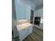 Kitchen with custom cabinets, decorative backsplash, granite counters, and stainless microwave oven at 1221 Azalea Garden Cir, Raleigh, NC 27603
