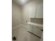 Bright laundry room features base cabinets, a countertop, and ample space for storage at 1221 Azalea Garden Cir, Raleigh, NC 27603