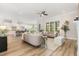 Bright living room with open layout and views to dining and kitchen area at 1221 Azalea Garden Cir, Raleigh, NC 27603