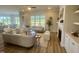 Bright and spacious living room featuring hardwood floors, fireplace, and an open floor plan at 1221 Azalea Garden Cir, Raleigh, NC 27603