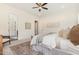 Comfortable main bedroom featuring a ceiling fan, area rug, and doorway at 1221 Azalea Garden Cir, Raleigh, NC 27603
