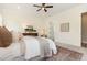 Lovely main bedroom featuring a ceiling fan, area rug, and doorway at 1221 Azalea Garden Cir, Raleigh, NC 27603