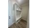 Mudroom featuring a white hall tree with cubbies, hooks, and bench seating, offering a convenient storage solution at 1221 Azalea Garden Cir, Raleigh, NC 27603