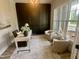 Bright home office with large windows and comfortable seating area at 1221 Azalea Garden Cir, Raleigh, NC 27603