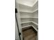Walk in Pantry, highlighting ample shelving for organized storage and laminate flooring at 1221 Azalea Garden Cir, Raleigh, NC 27603
