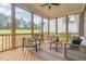 Relaxing screened-in porch featuring comfortable seating and views of the backyard at 1221 Azalea Garden Cir, Raleigh, NC 27603