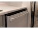 Close-up of a modern white dishwasher, seamlessly integrated into the kitchen cabinetry with sleek, flush design at 1332 Stallings Rd, Chapel Hill, NC 27516