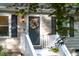 Inviting front door with 'Welcome' sign, a wreath, and freshly painted stairs at 1332 Stallings Rd, Chapel Hill, NC 27516