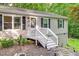 Exterior of the front door with stairs and black shuttered windows at 1332 Stallings Rd, Chapel Hill, NC 27516