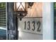 Close-up of the house number 1332 and a decorative outdoor light at 1332 Stallings Rd, Chapel Hill, NC 27516