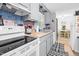 Well-lit kitchen featuring updated appliances and ample storage solutions at 1332 Stallings Rd, Chapel Hill, NC 27516