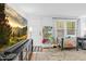 Stylish living room with modern entertainment center and plenty of play space at 1332 Stallings Rd, Chapel Hill, NC 27516