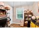 Bright office featuring a window with wood-look flooring and decorative shelving at 1332 Stallings Rd, Chapel Hill, NC 27516