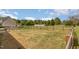 Expansive fenced backyard featuring a well-maintained lawn and ample space for outdoor activities at 158 Blande Dr, Kenly, NC 27542