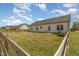 Fenced backyard with patio, perfect for outdoor dining and entertaining at 158 Blande Dr, Kenly, NC 27542