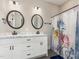 Bathroom with a double sink vanity, modern fixtures, and a shower/tub combination with a colorful curtain at 158 Blande Dr, Kenly, NC 27542