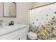Bathroom with a modern vanity, patterned shower curtain, and a clean, functional layout at 158 Blande Dr, Kenly, NC 27542